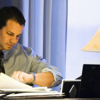 Businessman checking watch