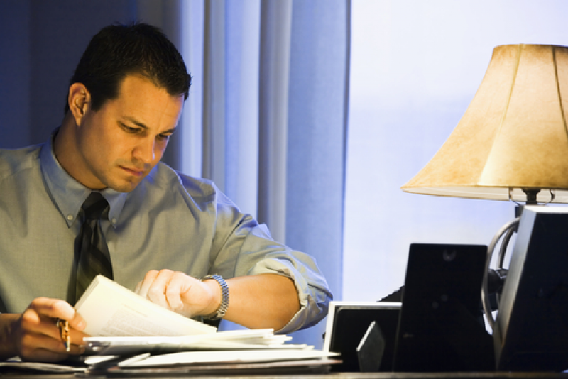 Businessman checking watch